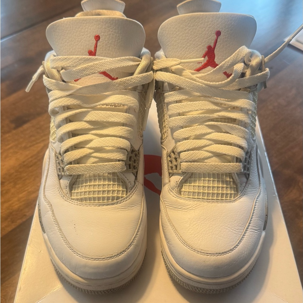 Authentic Jordan 4 Retro White Oreo sneakers.